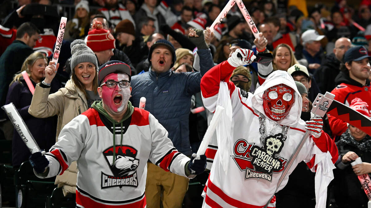 Charlotte Checkers fans cheer on the team as they prepare to battle the Rochester Americans during the 2024 Queen City Outdoor Classic at Truist Field in uptown Charlotte, N.C., on Saturday, January 13, 2024.