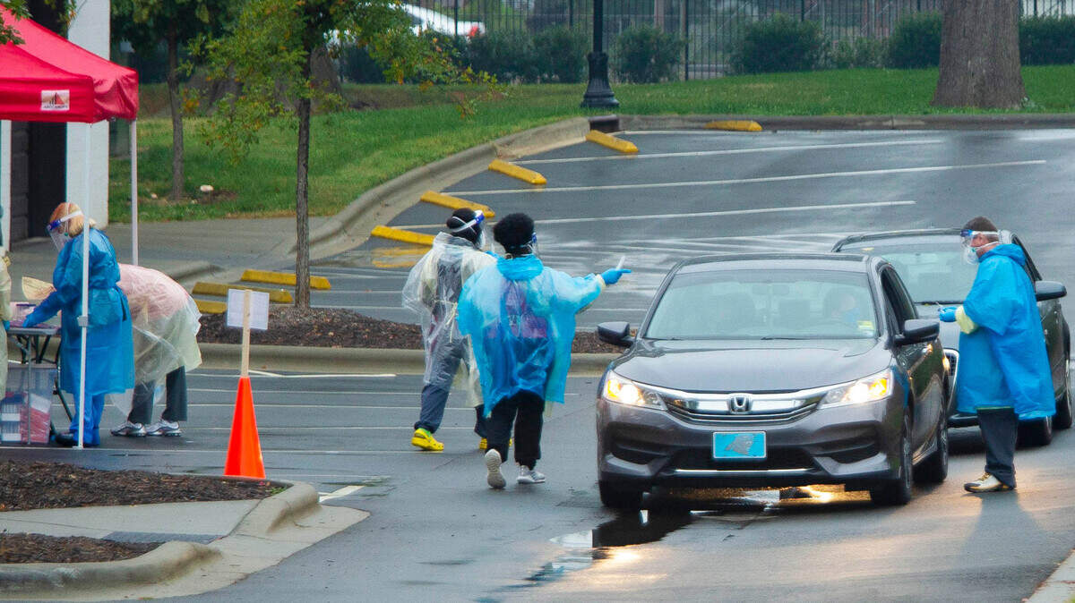 People get tested at a drive-thru Covid testing site at Olde Mecklenburg Brewing in Charlotte, NC on Saturday, October 10, 2020. Although it has not been considered a hotspot event, the brewery offered testing on Saturday so attendees could get tested.