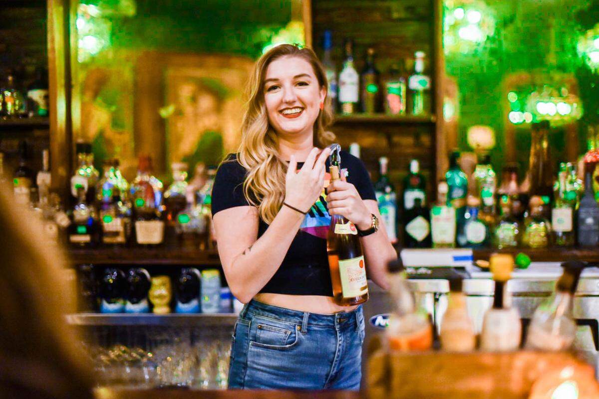 Bartender Ally Goddard mixes a drink at Single Barrel Room in Charlotte.