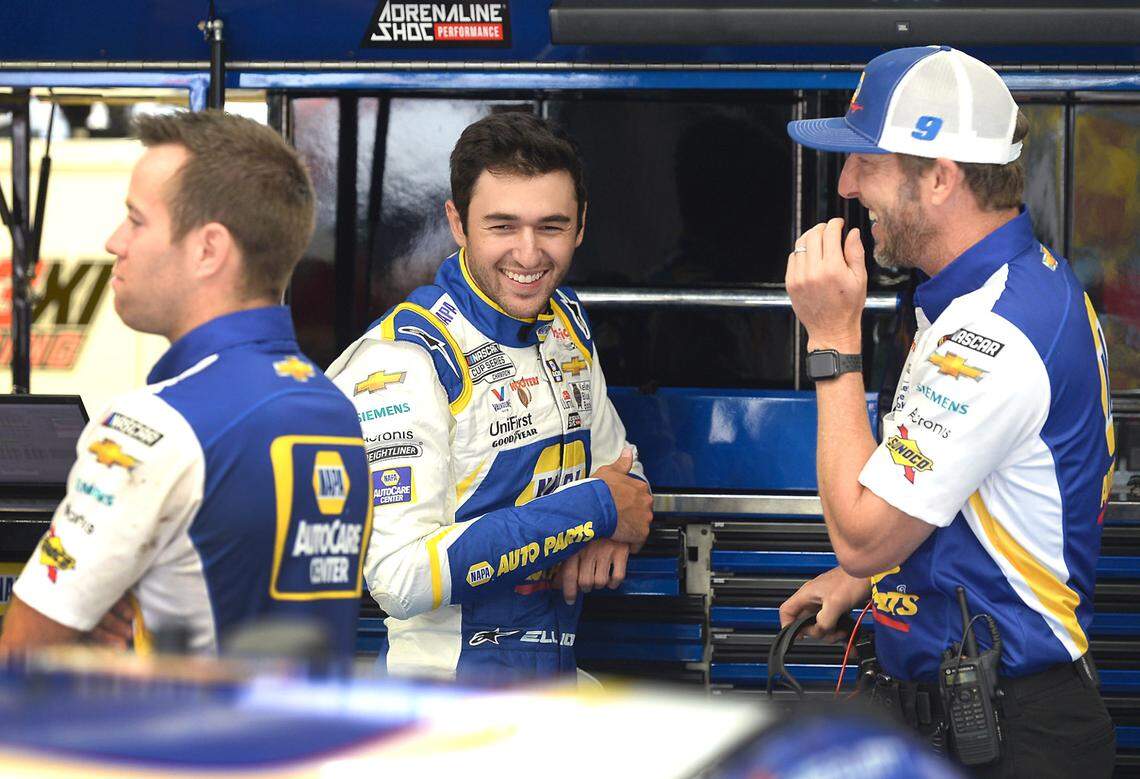 NASCAR Cup driver Chase Elliott, center, laughs with a member of his team prior to practice at Charlotte Motor Speedway on Friday, May 28, 2021. Elliott has been the sports most popular driver for three straight years and will be competing to win the Coca-Cola 600 on Sunday, May 30, 2021.