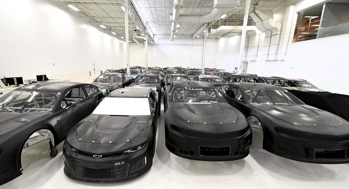 A graveyard of NASCAR race car bodies sit inside a storage area at Trackhouse Racing in Concord, NC on Tuesday, March 29, 2022. Team driver Ross Chastain won his first NASCAR Cup win and Trackhouse RacingÕs first-ever win at Circuit of the Americas on Sunday, March 27, 2022.