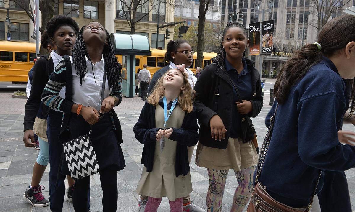 Students look up at the Blumenthal Performing Arts Center as they arrive to see a show during a school field trip in March 2016. That year, more than 12,000 Charlotte-Mecklenburg Schools fifth-grade students experienced “Endless Possibilities,” a performance tailored for 10- and 11-year-olds and featuring Opera Carolina, Charlotte Ballet and Charlotte Symphony.