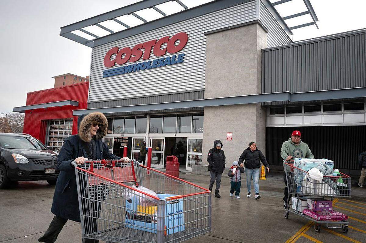 CHICAGO, ILLINOIS - DECEMBER 02: Customers walk in the parking lot outside a Costco store on December 02, 2025 in Chicago, Illinois. Costco is suing the Trump administration for a refund of tariffs the company alleges were improperly imposed by President Trump. The company contends that only Congress has the power to impose tariffs. (Photo by Scott Olson/Getty Images)