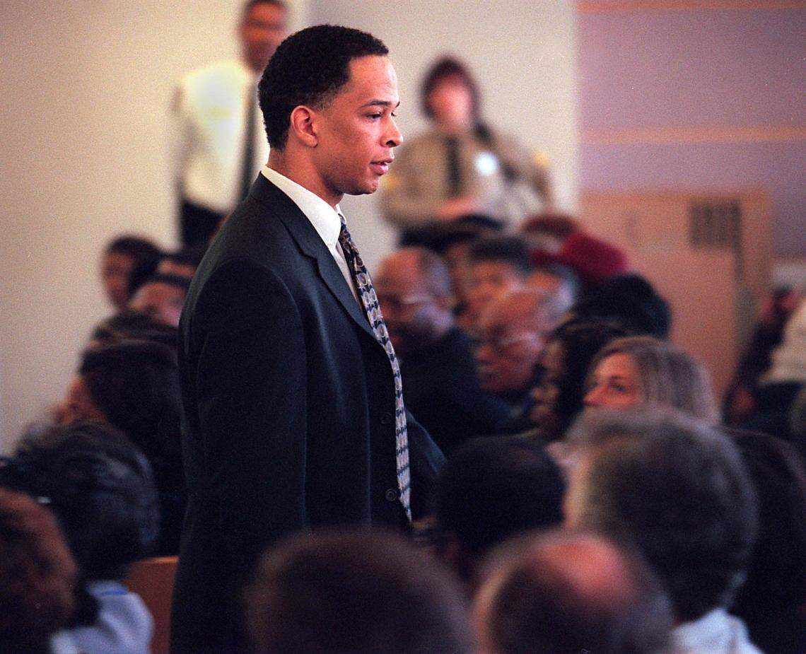 Former Carolina Panthers wide receiver Rae Carruth exits the courtroom after Judge Charles Lamm sentenced him to at least 18 years and 11 months in 2001 for conspiring to murder his pregnant girlfriend, Cherica Adams.