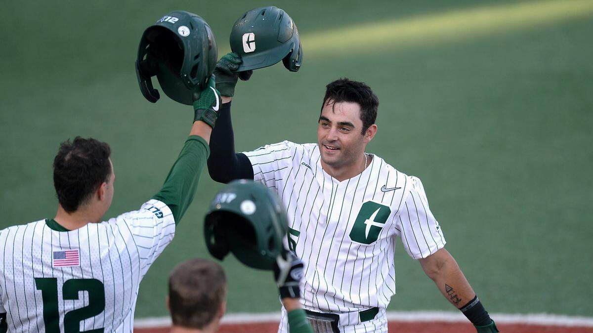 Charlotte 49ers shortstop Jack Dragum, right, is congratulated by teammates after hitting a solo home run against UNCW on Thursday, May 20, 2021. The 49ers are having the best season in school history and may host NCAA tournament games.