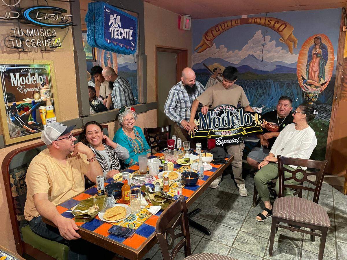 The Palomera family in El Chapala before Helene in front of a mural celebrating Saul Palomera’s native region of Tequila Jalisco.