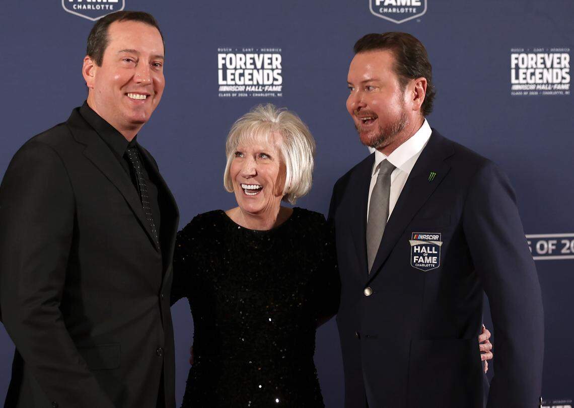 NASCAR driver Kyle Busch, mother Gaye Busch and former NASCAR driver and 2026 Hall of Fame inductee Kurt Busch pose for photographs on the red carpet at the NASCAR Hall of Fame on Friday, January 23, 2026. Kurt Busch along with Harry Gant and Ray Hendrick were enshrined Friday.