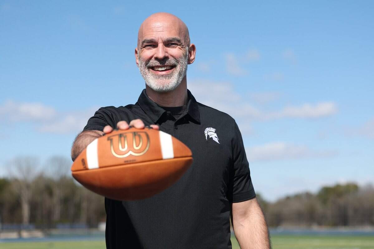 Kenneth McClamrock is the new football coach at Community School of Davdison in Huntersville, NC. McClamrock posed for a portrait on the school's football field on Monday, February 23, 2026.