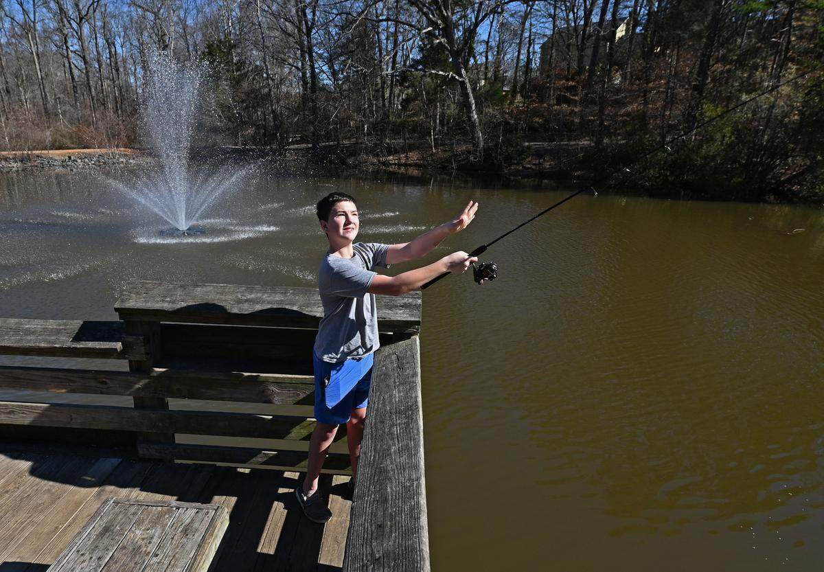 Camdon Carey, 12, enjoys casting a line at Squirrel Lake Park in Matthews, NC on Tuesday, February 4, 2025. The temperature is expected to reach 76 degrees with sunny skies on Tuesday, 22 degrees above the average 30-year high for February 4th, a National Weather Service meteorologist said.