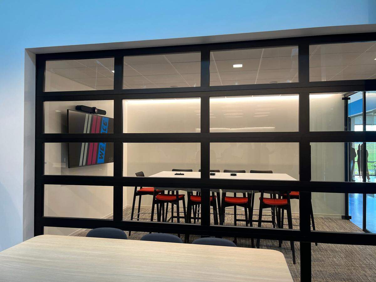 Many windows in NASCAR’s brand-new building resemble garage doors.