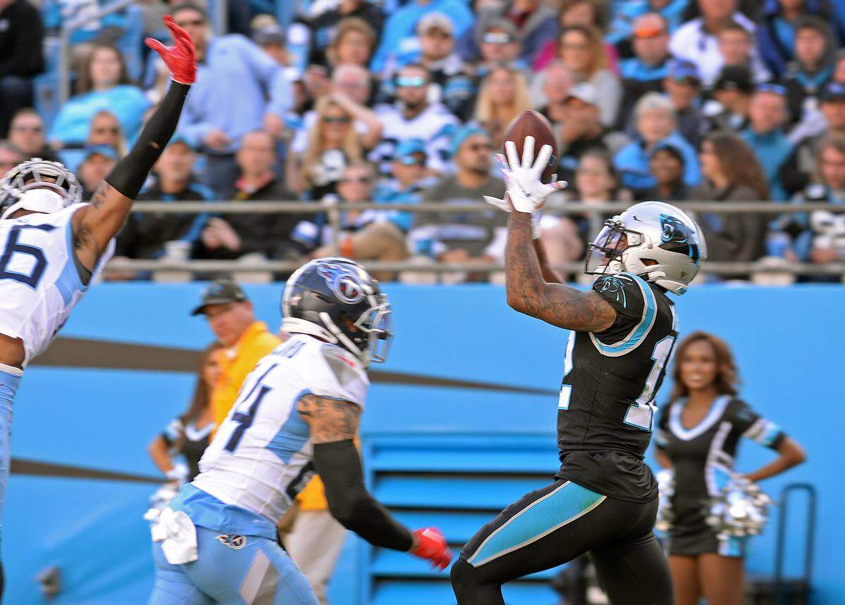 Carolina Panthers wide receiver DJ Moore (right) made a toe-tapping 32-yard catch on Sunday that set up a one-yard score by running back Christian McCaffrey.