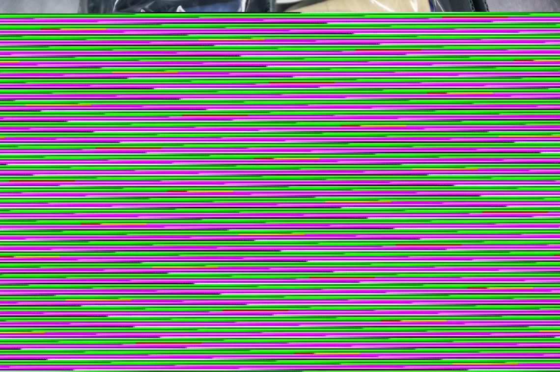 Spools of thread from an old textile plant sit in a Levine Museum box.