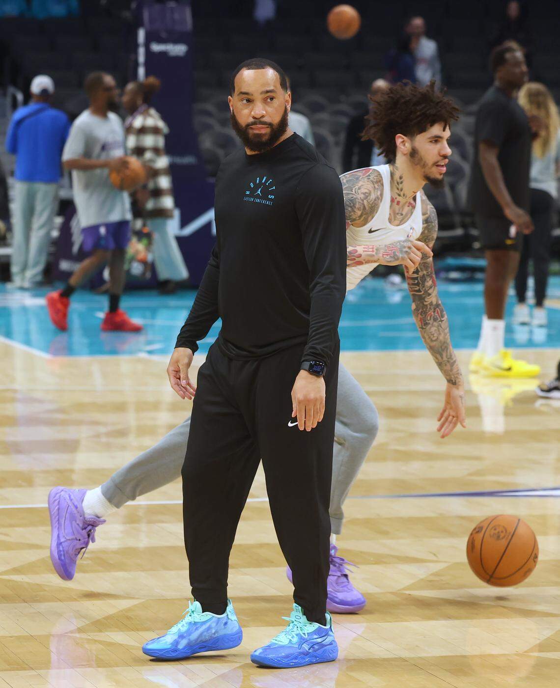 Charlotte Hornets assistant coach Lamar Skeeter, left, works out guard LaMelo Ball, right, prior to the team’s game against the Indiana Pacers at Spectrum Center in Charlotte, North Carolina, on Thursday, Jan. 8, 2026.
