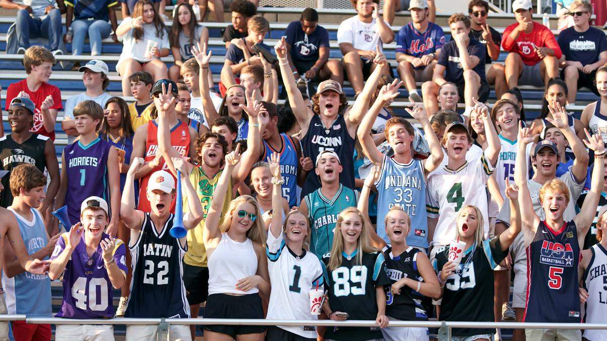 The Latin student section cheers on Hawk’s football.
