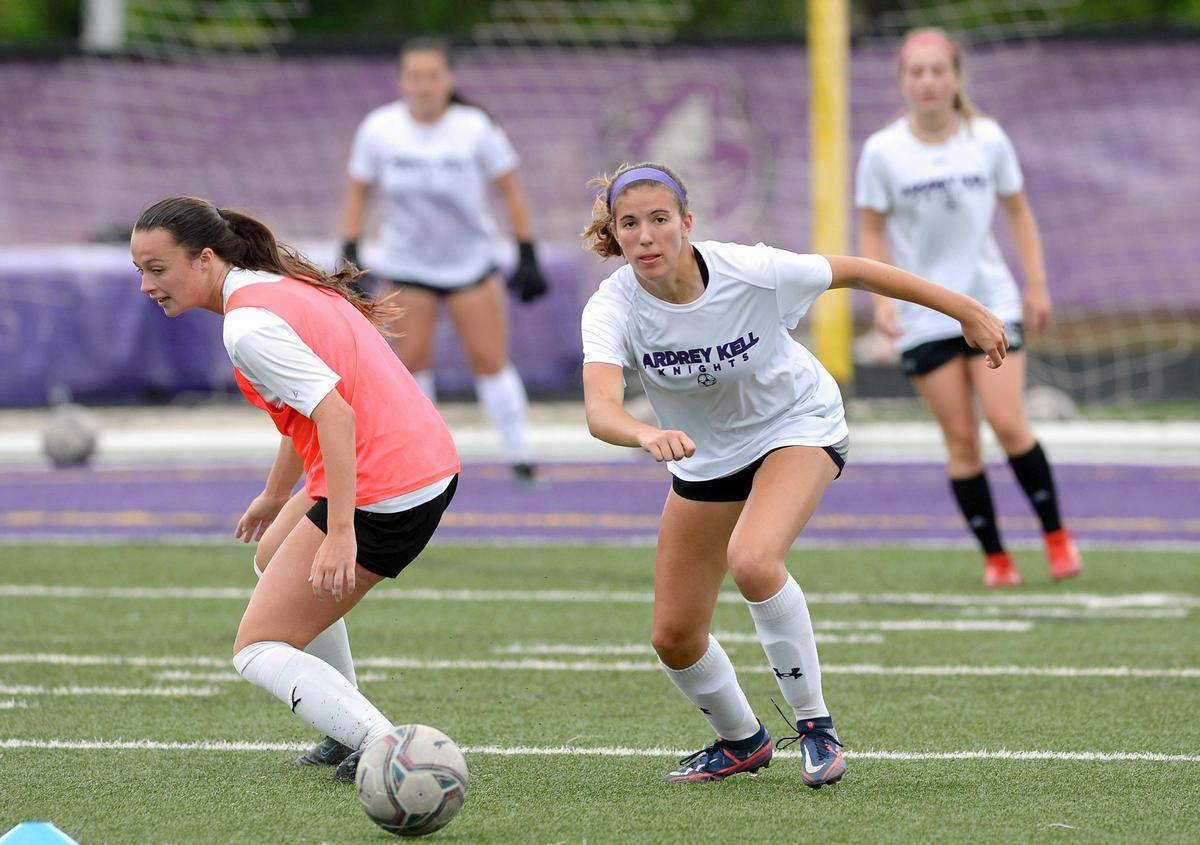 Ardrey Kell soccer player Ellie Riechman, right, pursues the ball during practice on Thursday, May 12, 2022. The Knights are ranked in the top 20 nationally and number one in North Carolina. Head coach Kim Montgomery will lead the Knights as they begin play in the NCHSAA 4A state championship.