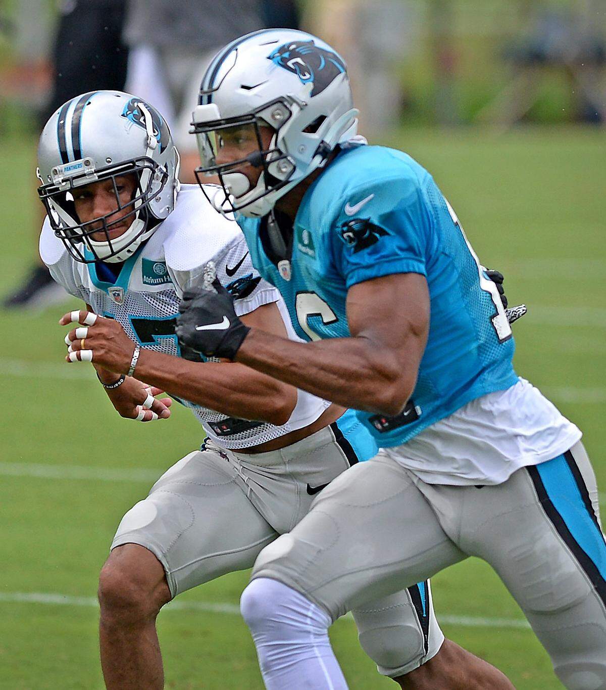 Kieth Cockrell’s son Ross Cockrell, left, plays cornerback for the Tampa Bay Buccaneers and previously played for the Carolina Panthers.