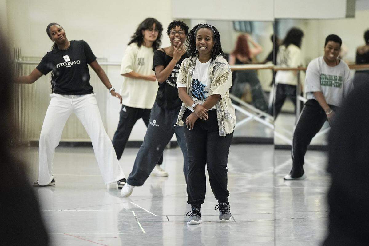 Assistant professor of dance Ashley Tate, center, teaches a dance routine ahead of the hip hop symposium she is producing at UNC Charlotte, Wednesday, Sept. 24, 2025, in Charlotte, N.C.