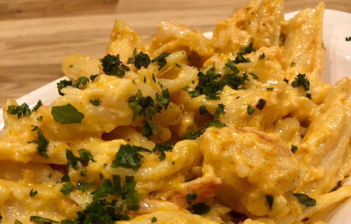 Creamy lobster mac and cheese is a signature dish at Cuzzo’s Cuisine.