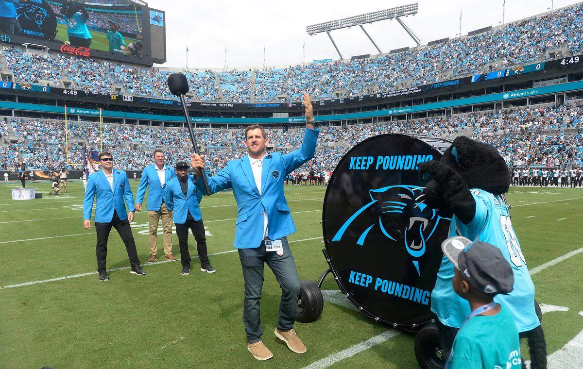 Empty seats can be seen at Bank of America Stadium as former Carolina Panthers player Jordan Gross prepares to hit the Keep Pounding drum, joined by Steve Smith, Sr, Wesley Walls, and Jake Delhomme prior to the team playing the Jacksonville Jaguars at Bank of America Stadium in Charlotte, NC on Sunday, October 6, 2019.