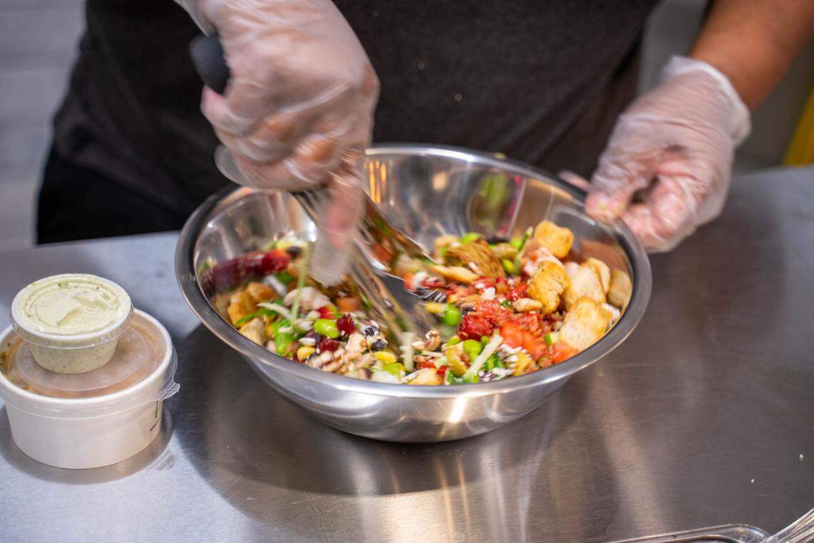 Each salad is tossed at Salata, even when the dressing is on the side.