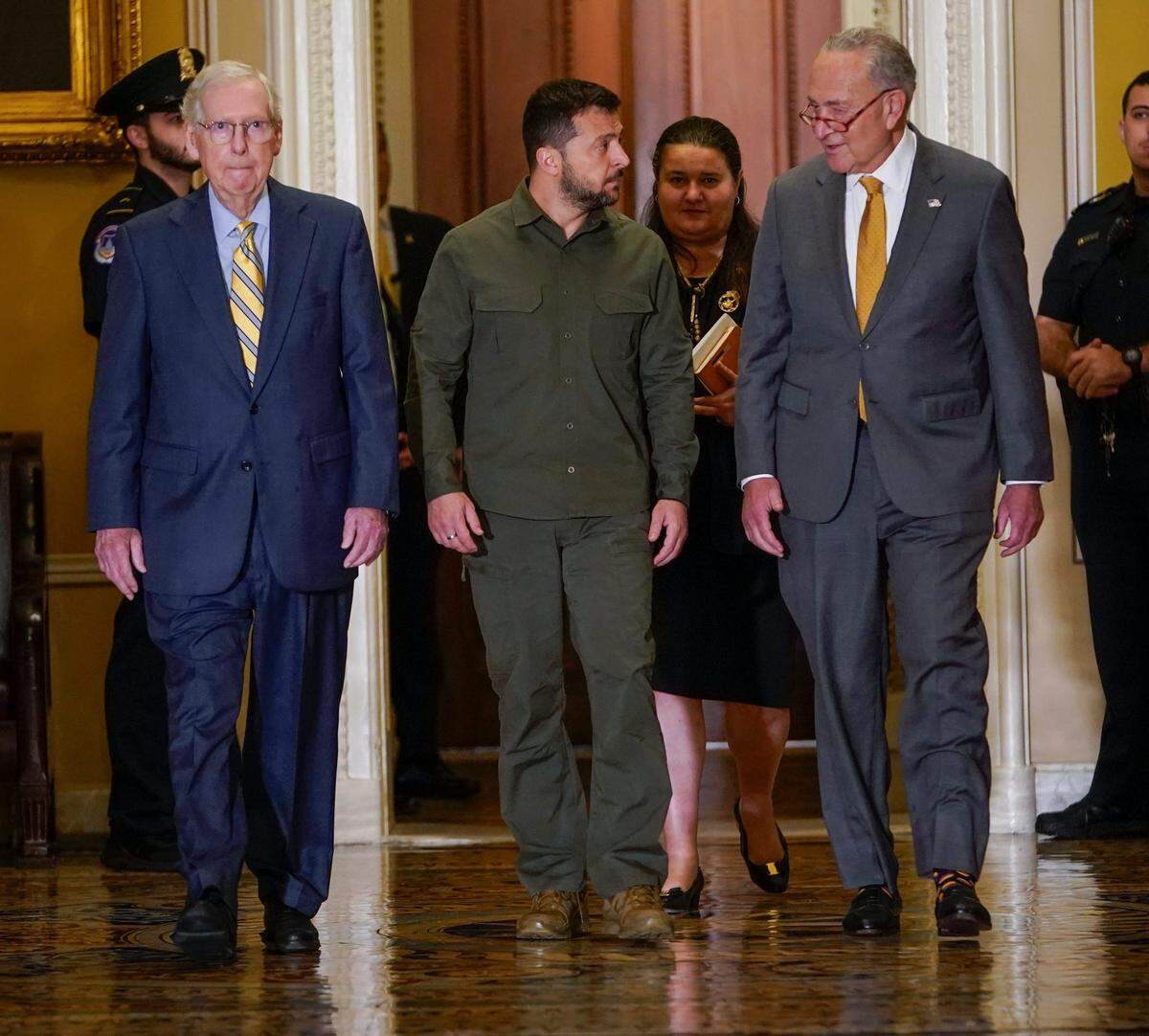 Ukrainian President Volodymyr Zelenskyy, center, with Senate Majority Leader Chuck Schumer, right, and Senate Minority Leader Mitch McConnell, left, walk to a meeting in the U.S. Capitol on Sept. 21, 2023. Zelenskyy pitched lawmakers on continuing aid to Ukraine.