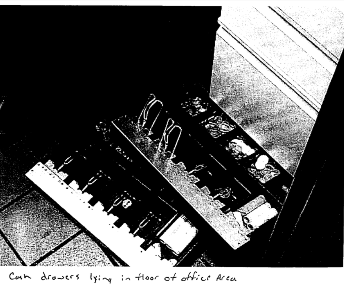 Photo of cash register drawers on the floor of the McDonald’s Jeffrey Manchester robbed.