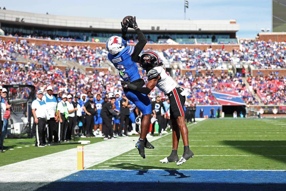 Southern Methodist wide receiver Jordan Hudson catches a pass for a touchdown in front of Louisville defensive back Jabari Mack during the first half at Gerald J. Ford Stadium on November 22, 2025 in Dallas, Texas. (Photo by Stacy Revere/Getty Images)