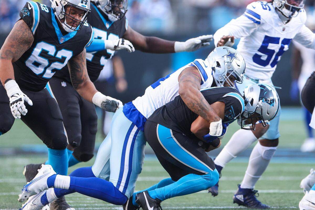 Cowboys defensive end Sam Williams (54) sacks Panthers quarterback Bryce Young (9) during the game at Bank of America Stadium on Sunday, November 19, 2023 in Charlote, NC.