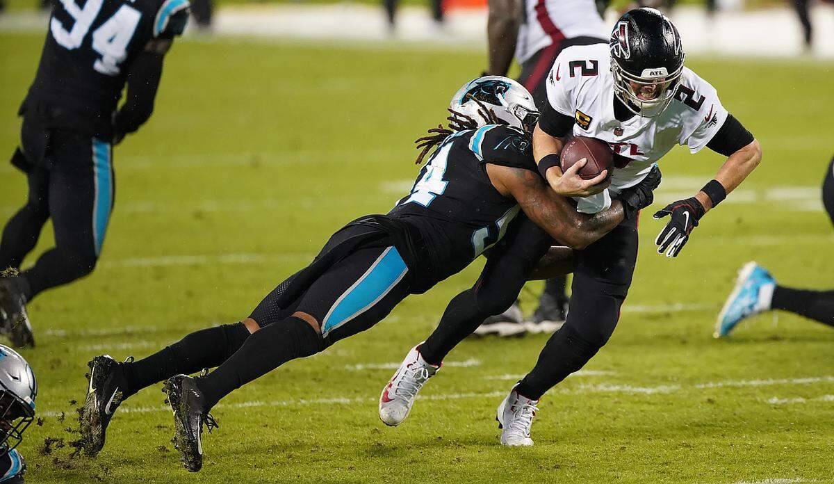 Carolina Panthers linebacker Shaq Thompson sacks Atlanta Falcons quarterback Matt Ryan (2) in first half action Thursday night, Oct. 29, 2020.