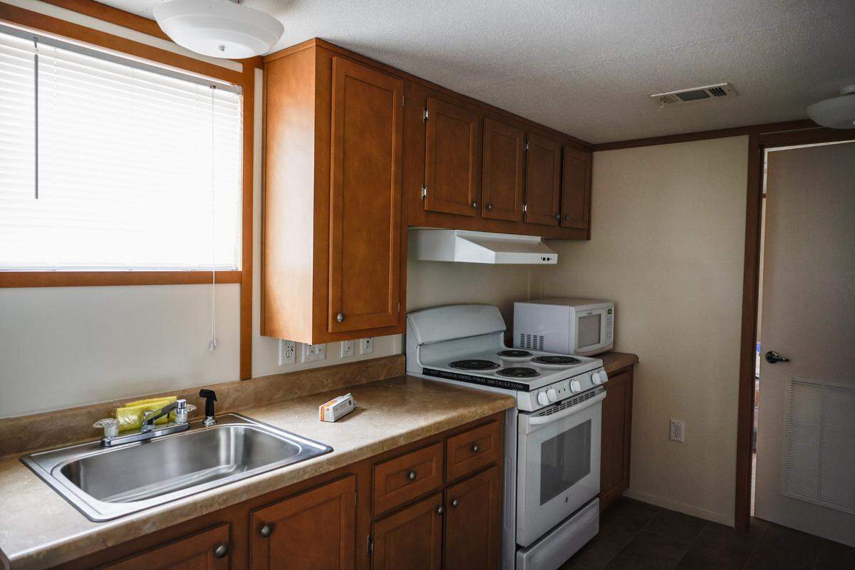 After hotel stays in Charlotte, Marion and Asheville, Karen Schmid’s FEMA-provided trailer is where she can cook have time alone, both of which are precious to her.