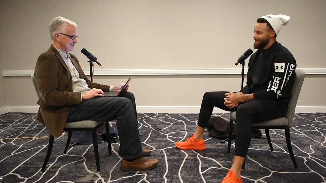 NBA star Steph Curry (right) is interviewed by Charlotte Observer sports columnist Scott Fowler for the “Sports Legends of the Carolinas” project on Nov. 18, 2022, in Houston, Texas. Curry was one of 15 legends with deep roots in the Carolinas who was interviewed for Season 1 of the project.