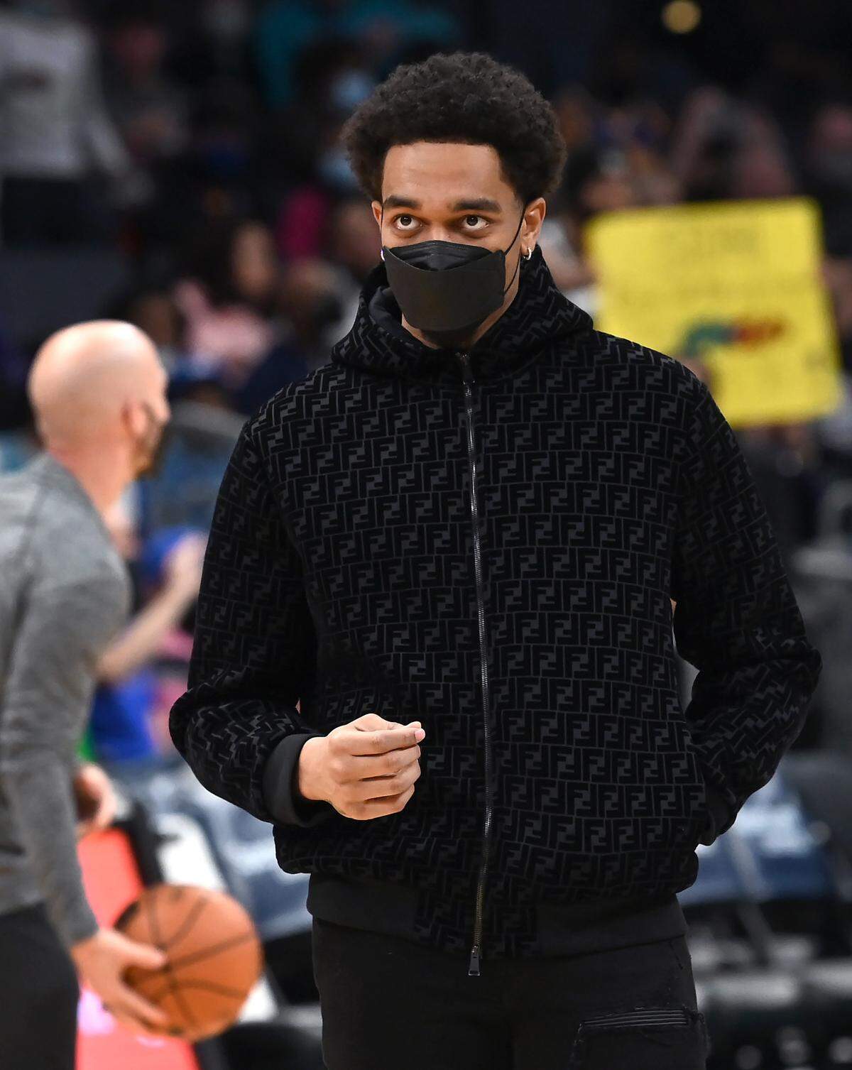 Charlotte Hornets forward PJ Washington watches his teammates warmup prior to action against the Golden State Warriors at Spectrum Center in Charlotte, NC on Sunday, November 14, 2021.