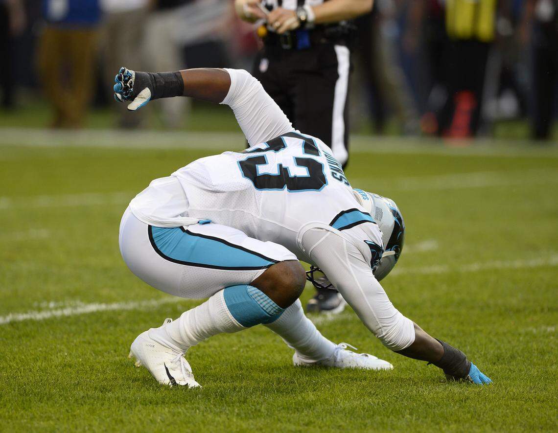 Carolina Panthers defensive end Brian Burns (53) celebrates his sacks with a Spider-man pose.
