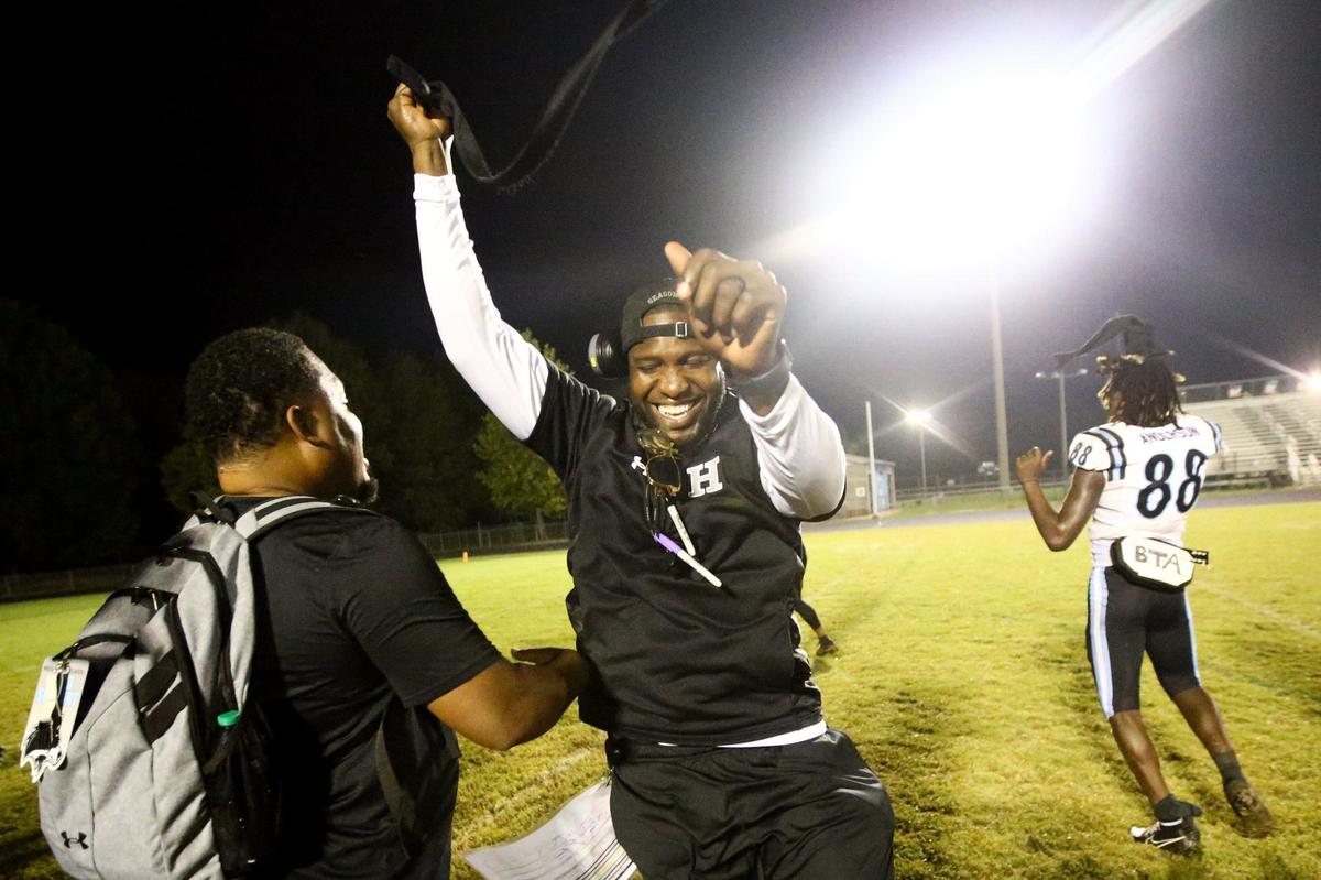 CHARLOTTE, NC - SEPTEMBER 16: Hough High School head coach DeShawn Baker celebrates after the win against Julius L. Chambers High School, 58-3, at Julius L. Chambers High School in Charlotte, NC on September 30, 2024.