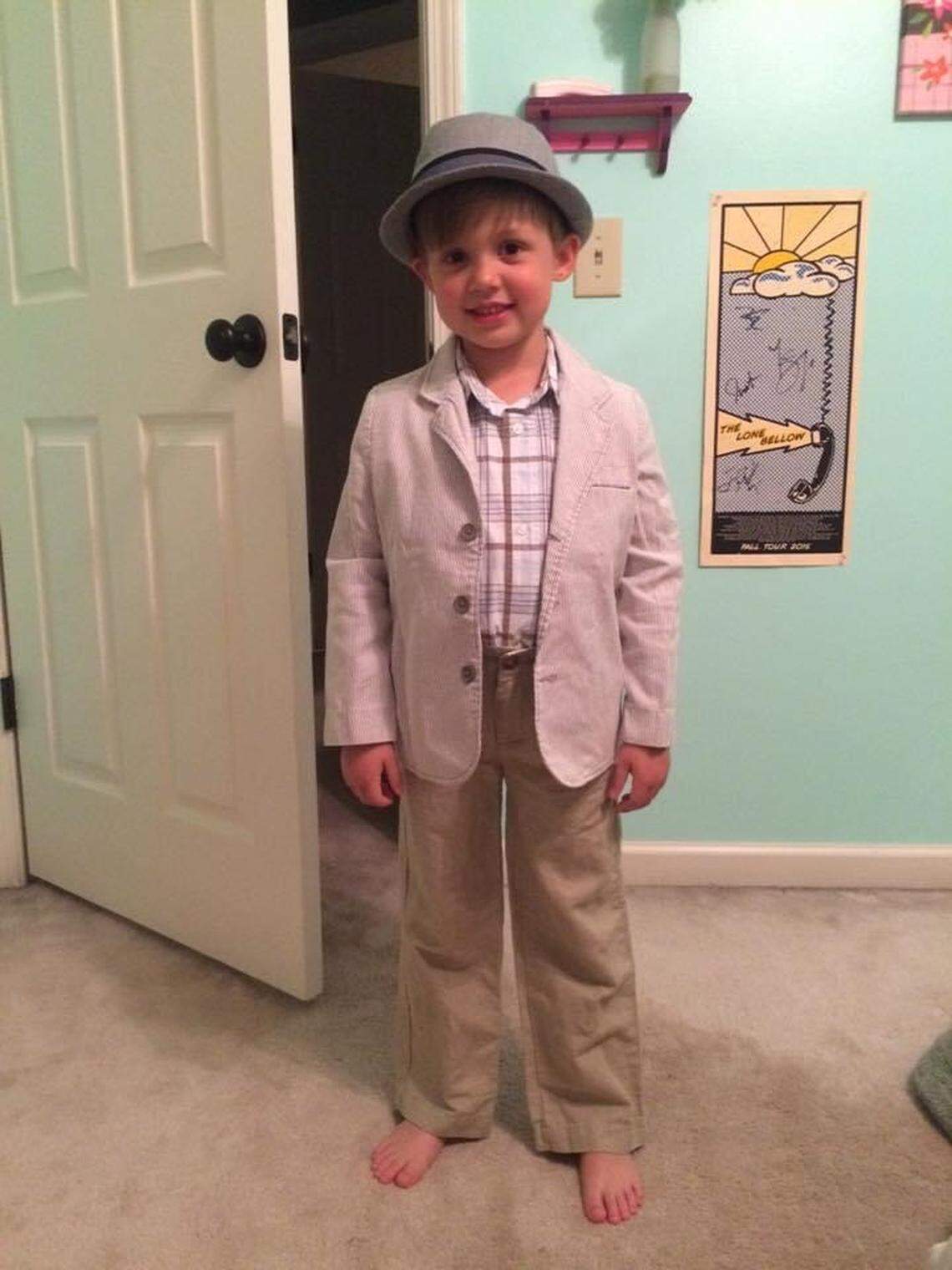 Mike Dumas models his new clothes after shopping in the boys department for the first time soon after he turned 5.