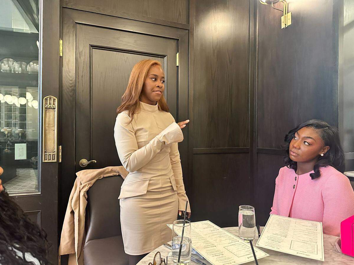 Monica Josey, the creator of Sista Story Society addresses the book club before their monthly meeting and Brunch & Book Swap at La Belle Helene in Uptown Charlotte.