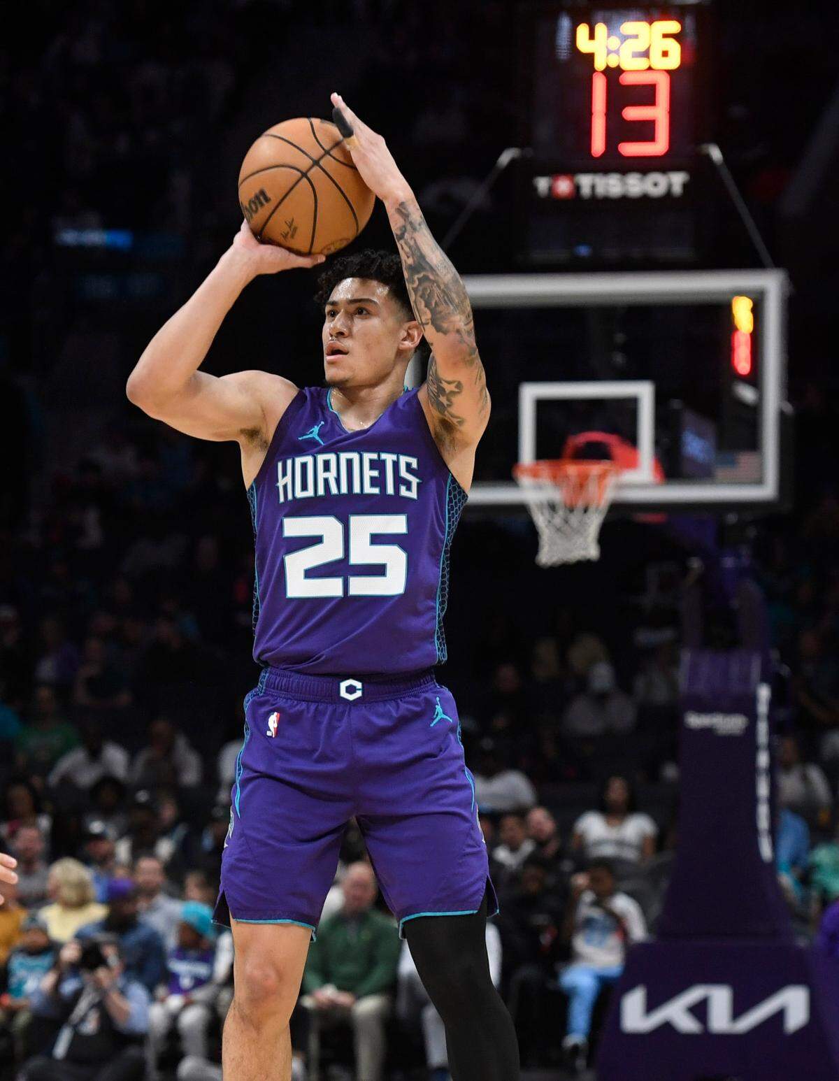Charlotte Hornets guard KJ Simpson shoots during an April game at Spectrum Center.