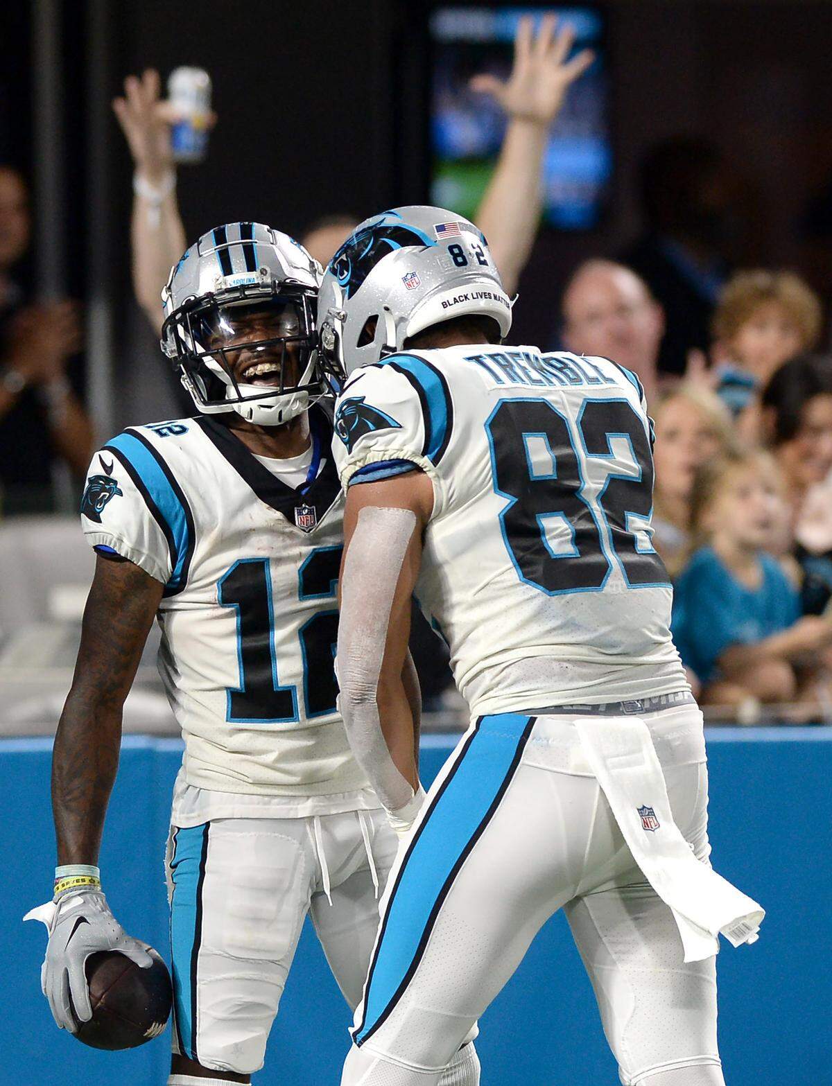 Carolina Panthers wide receiver Shi Smith, left, smiles as he is congratulated by tight end Tommy Tremble, right, following a touchdown pass reception against the Buffalo Bills at Bank of America Stadium in Charlotte, NC on Friday, August 26, 2022.