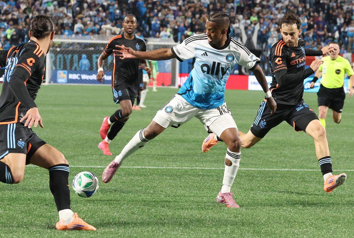 Charlotte FC right wing Kerwin Vargas, center, loses control of the ball during action against the New York City FC on Friday, November 7, 2025. The New York City FC defeated Charlotte FC 3-1 in Game 3 of the MLS Playoffs at Bank of America Stadium in Charlotte, NC.