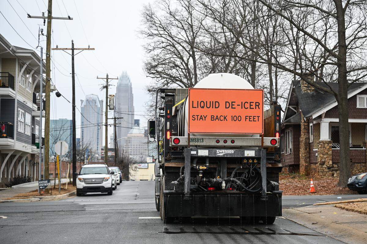 A de-icer truck makes its way through the Lockwood neighborhood on Friday, Jan. 23, 2026 in preparation for winter weather, including ice, expected in the Charlotte area this weekend.