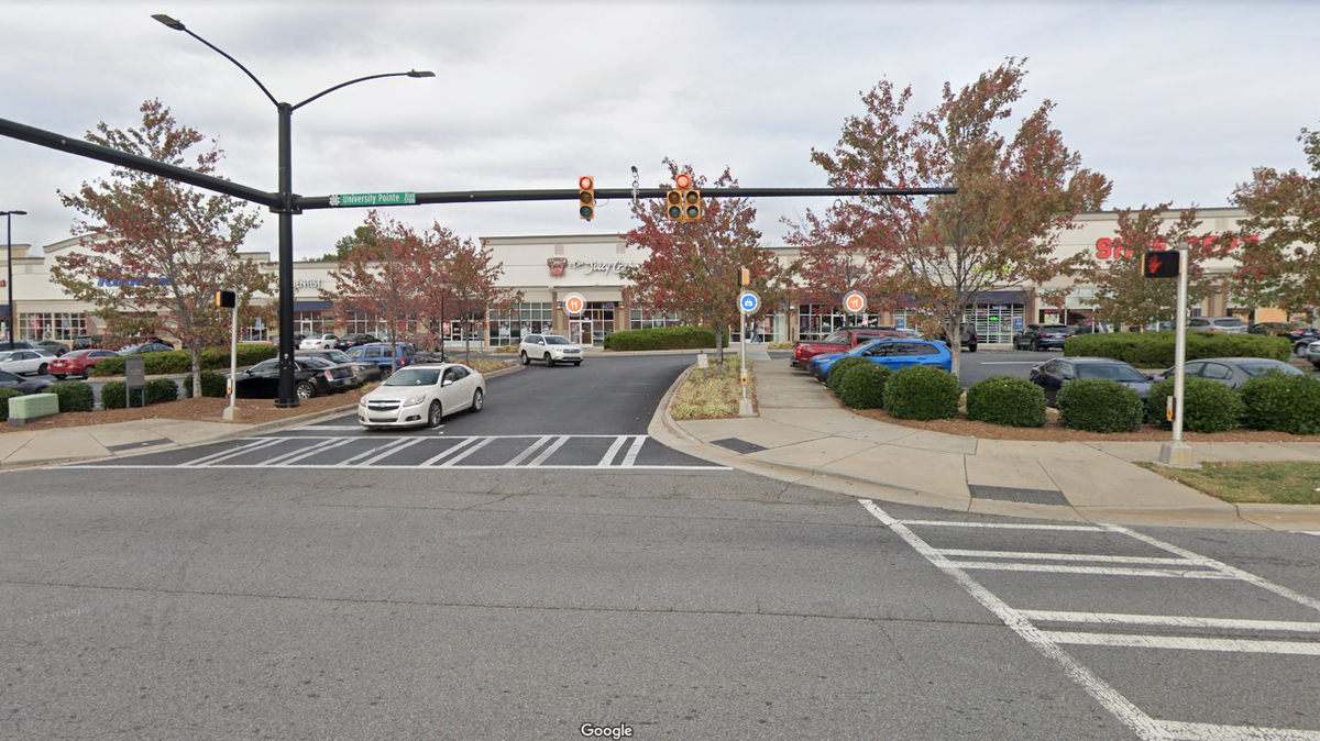 The shooing happened in the parking lot of a shopping area in the 5700 block of University Pointe Boulevard, CMPD said.