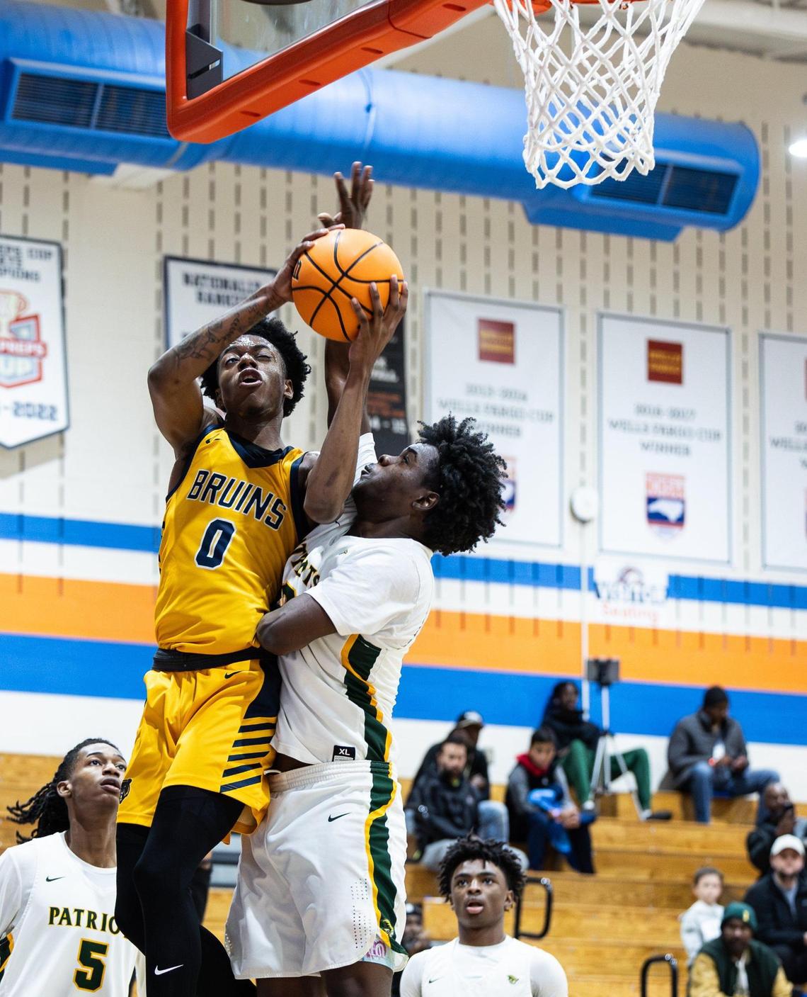 Lancaster Bruins Jordan Watford, left, shoots past Independence Patriots Jaxson Neely during the Phenom Hoops New Year’s Bash at Marvin Ridge High School in Waxhaw, N.C., on Friday, December 27, 2024.