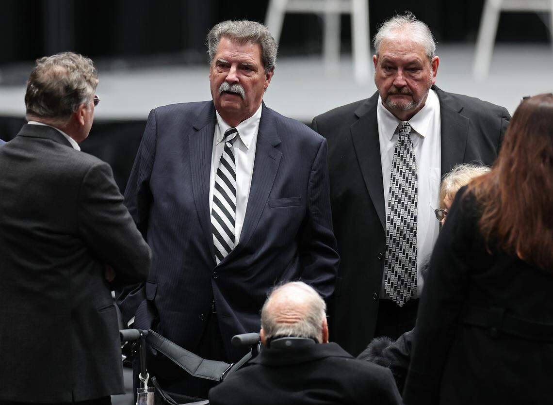 Longtime NASCAR executive Mike Helton, center, attends a Gathering in Remembrance ceremony at Bojangles Coliseum on Friday in Charlotte. The ceremony was held to honor the lives lost in the Dec. 18, 2025 plane crash in Statesville that included former NASCAR driver Greg Biffle. 