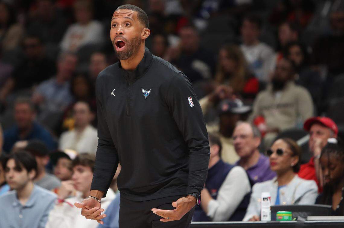 Charlotte Hornets head coach Charles Lee on the bench during the first quarter against the Atlanta Hawks at State Farm Arena.