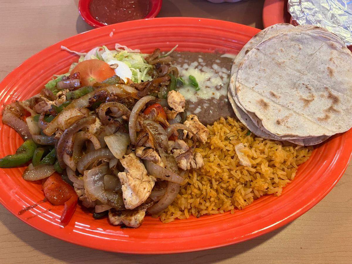 The chicken fajitas at La Victoria Cocina Mexicana & Bar come with your choice of flour tortillas or housemade corn tortillas (shown here).
