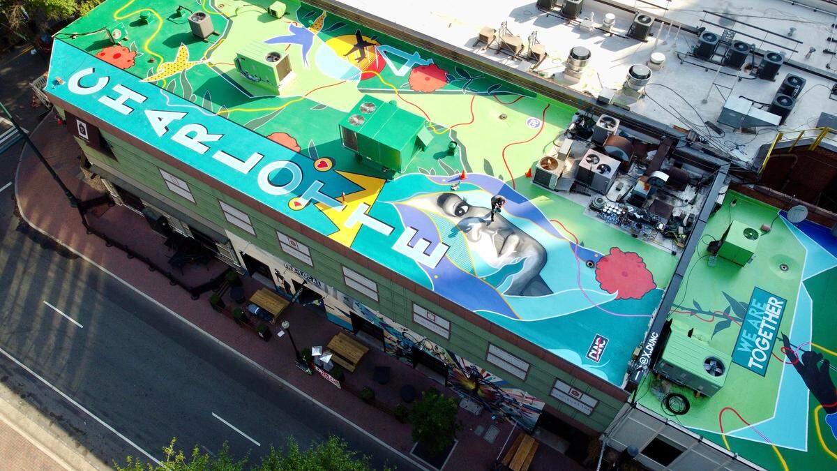 Artist Alex Duncan went over 40 variations and 12 designs before landing on a final version of the mural with Binaco Real Estate President Vijay Bhojwani.