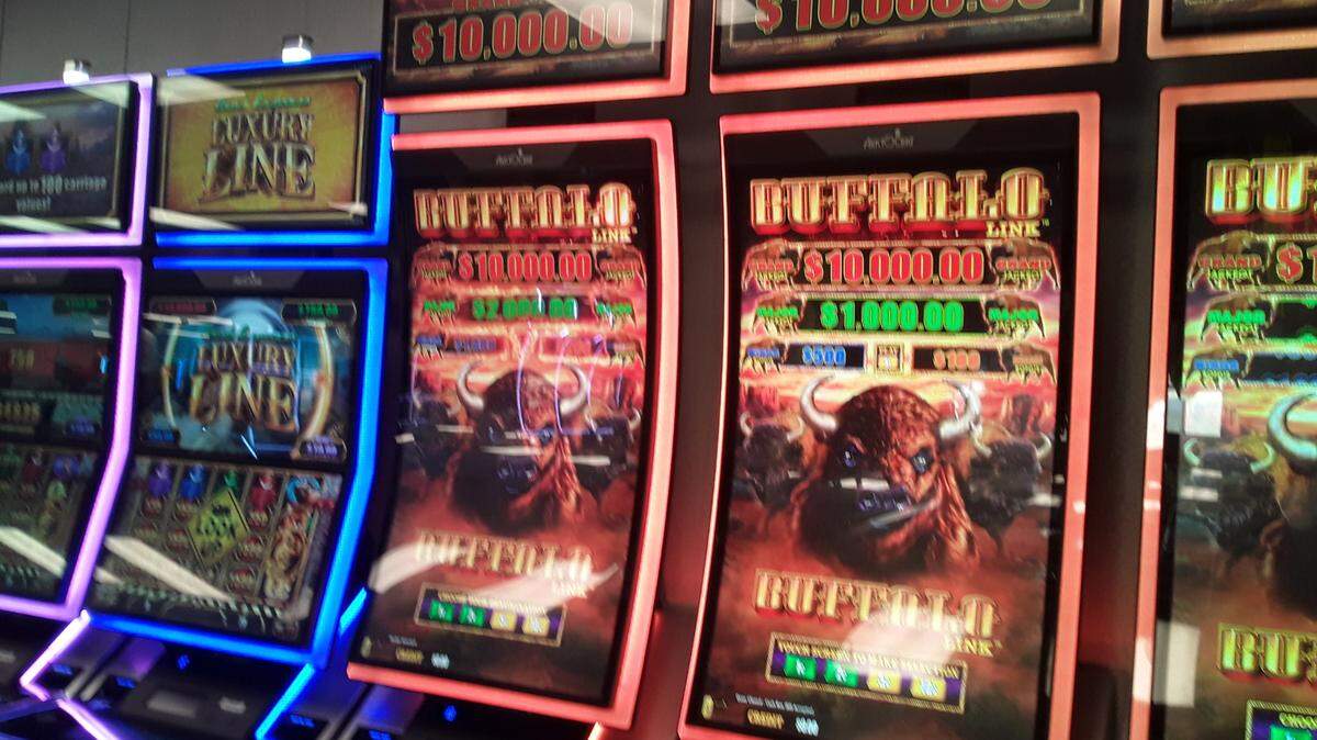 As construction on the casino project continues, these slot machines have been installed in a temporary 500-machine facility.