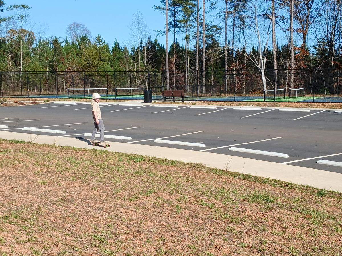 Ten-year-old Nolan Bugg of Hickory zooms down a sloped sidewalk at Mountain Creek Park in Sherrills Ford on Wednesday, Nov. 9, 2022.