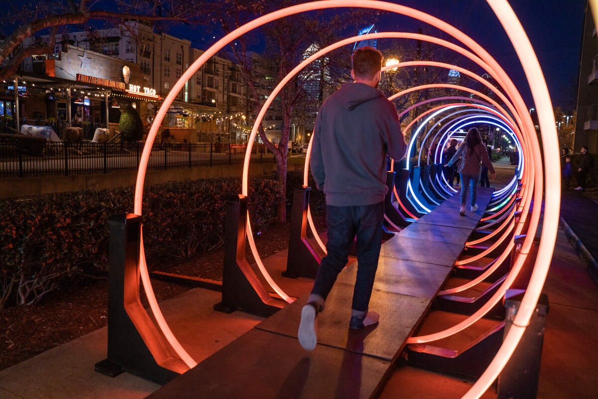 The interactive light display in South End Charlotte known as Passage has become a popular stop on the Rail Trail. People go through multiple times to activate the lights and sounds.