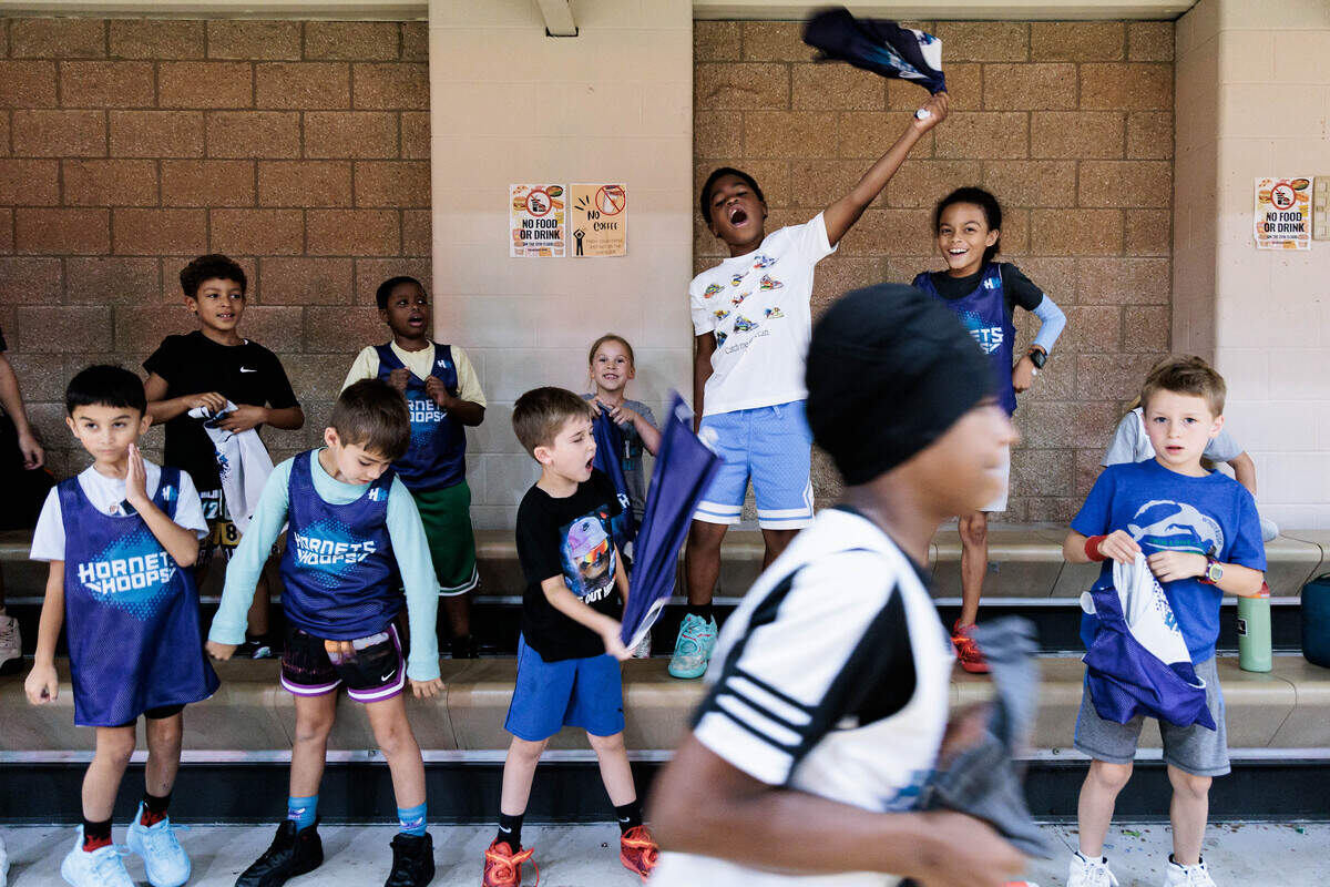 Hornets Hoops campers cheer while their teammates play in front of Charlotte Hornets first-round draft picks Hannes Steinbach and Christian Anderson Jr. on Wednesday, June 24, 2026 at Covenant Presbyterian Church. “They’re professionals and they’re watching us play,” 7-year-old camper Hadley Mills said. “Some of us may grow up to be one of them someday.”